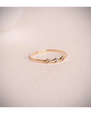 Sortija oro 18k amarillo bambú con 3 circonitas azules