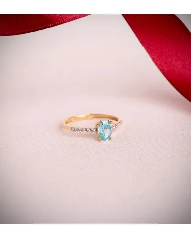 Sortija oro 18k bicolor topacio natural paraiba oval 7x5 mm
