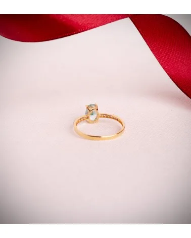 Sortija oro 18k bicolor topacio natural paraiba oval 7x5 mm
