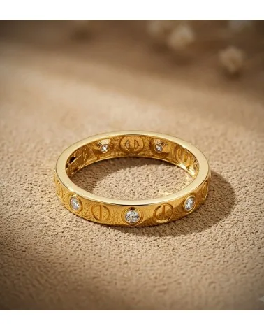 Sortija oro 18k amarillo circonitas y motivo de tornillos
